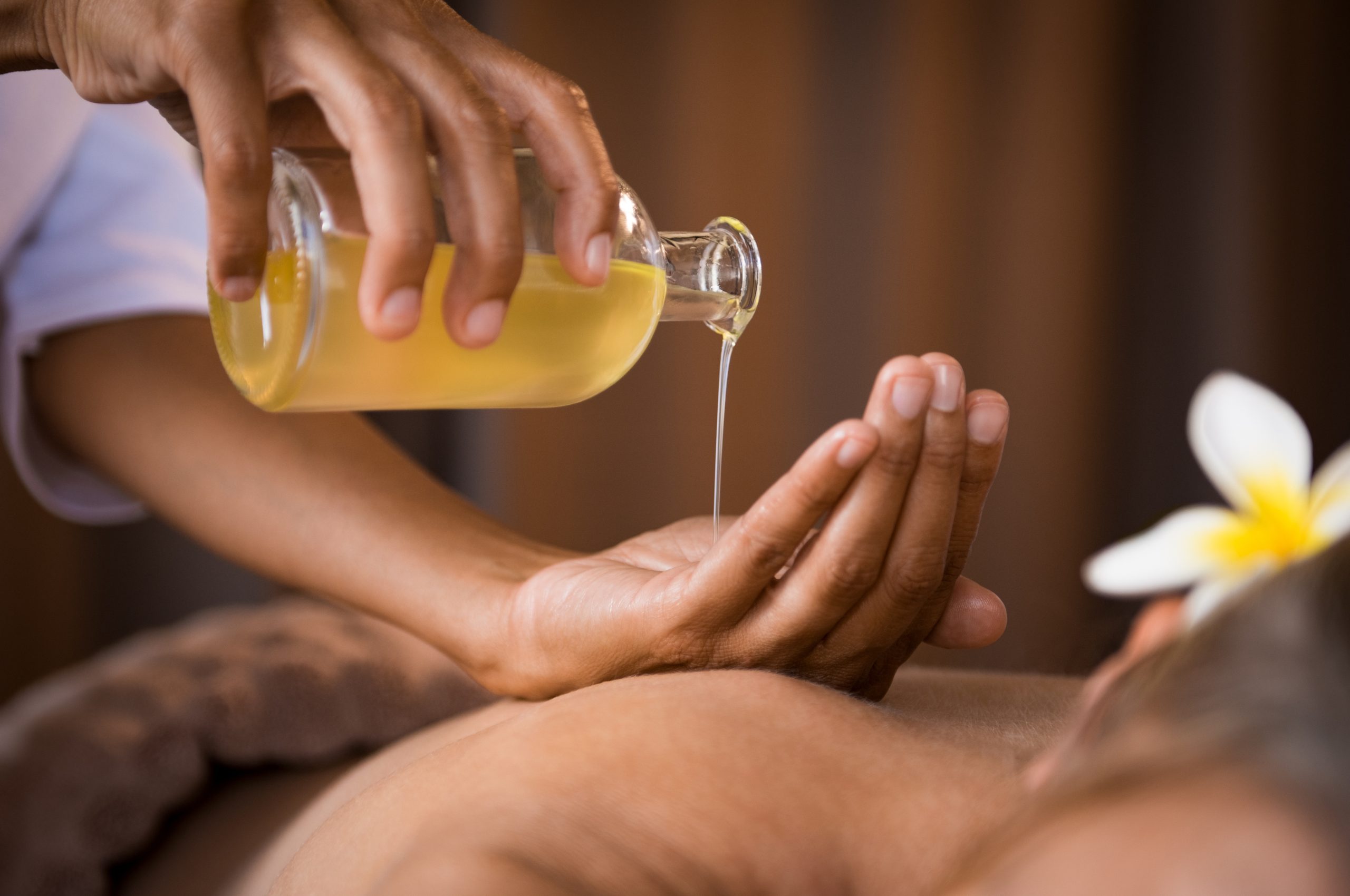 Therapist Pouring Massage Oil At Spa Therapist Pouring Massage Oil At Spa